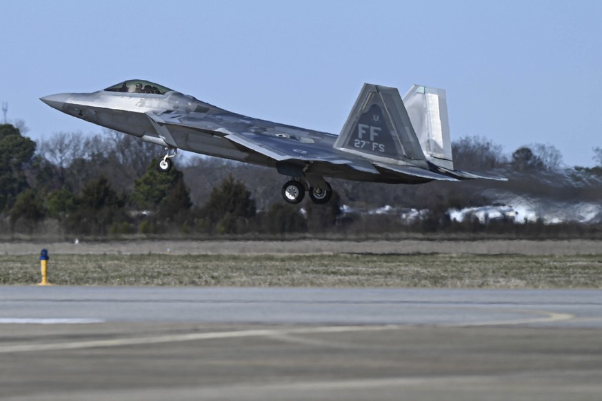 This photo provided by the U.S. Air Force shows a U.S. Air Force pilot taking off in an F-22 Raptor at Joint Base Langley-Eustis, Va., Saturday, Feb. 4, 2023. At the direction President Joe Biden, mil ...