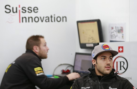 Moto2 rider Jesko Raffin of Switzerland looks at a monitor during the free practice session for the MotoGP Japanese Motorcycle Grand Prix at the Twin Ring Motegi circuit in Motegi, north of Tokyo, Fri ...
