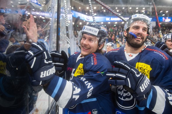 Ambri&#039;s player Simone Terraneo and Ambri&#039;s player Zaccheo Dotti celebrate at the end of the National League preliminary round game between HC Ambri-Piotta and the EHC Kloten at the Gottardo  ...