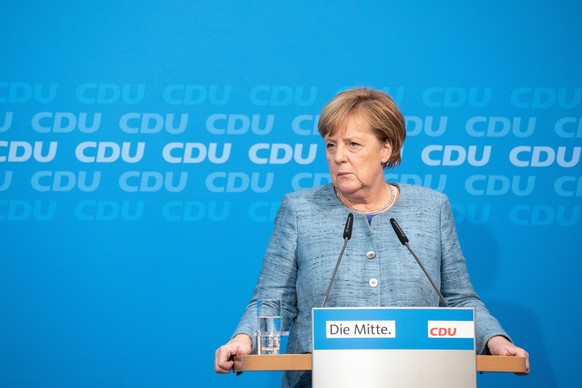 epa07109880 German Chancellor Angela Merkel delivers a statement with Volker Bouffier (not pictured), Deputy Leader of the Christian Democratic Union (CDU) and Hesse Premier, after a board meeting at  ...