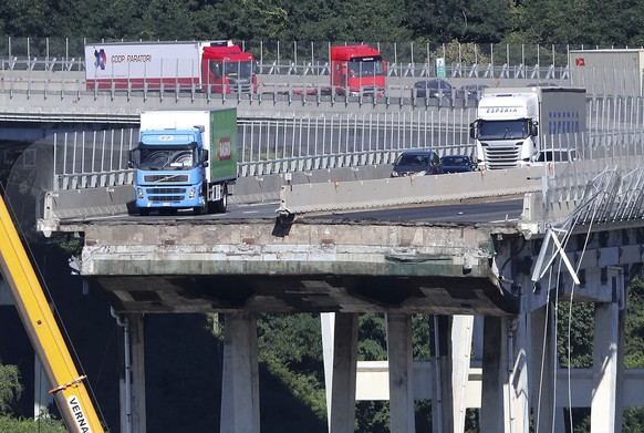 A view of the Morandi highway bridge that collapsed in Genoa, northern Italy, Wednesday, Aug. 15, 2018. A large section of the bridge collapsed over an industrial area in the Italian city of Genova du ...