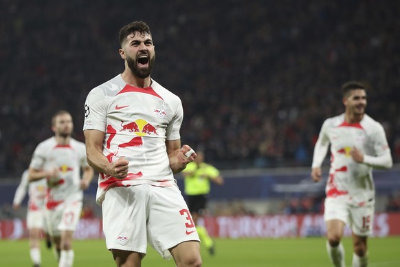 Leipzig&#039;s Josko Gvardiol celebrates after scoring his side&#039;s opening goal during the UEFA Champions League round of sixteen first leg soccer match between RB Leipzig and Manchester City in L ...