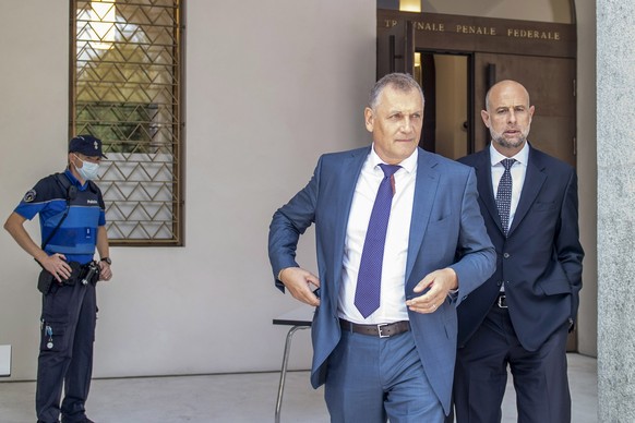 epa08668236 Former Fifa general secretary Jerome Valcke, center, and his lawyer Patrick Hunziker arrive at the Federal Criminal Court in Bellinzona, Switzerland, 14 September 2020. PSG president Al-Kh ...