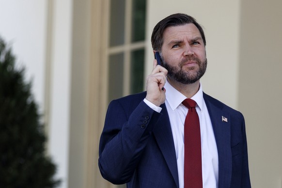 epa12864895 US Vice President JD Vance on the phone following the swearing in of Colin McDonald as Assistant Attorney General for National Fraud Enforcement in the Eisenhower Executive Office Building ...