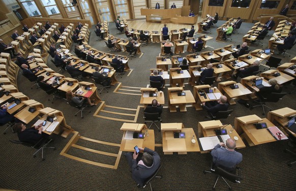 epa08336997 Nicola Sturgeon (rear, C), First Minister of Scotland during a Scottish Parliament session at Holyrood for the First Mi?nister&#039;s statement on the coronavirus pandemic, in Edinburgh, S ...