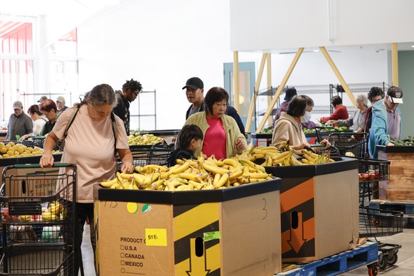 epa12501442 Clients shop at the Alameda Food Bank facility, designed as a community market for a safer, more dignified, and efficient shopping experience for its clients in Alameda, California, USA, 0 ...