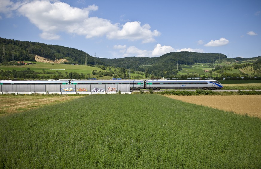 A type CIS 40 first generation Pendolino tilting train of "ETR 610 Cisalpino" Inc. is underway to Basel in the vicinity of Itingen in the canton of Basel-Land (Basel-Country), Switzerland, p ...