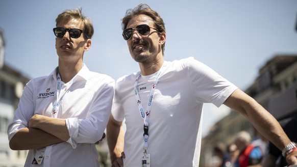 Raphael Meyer, CEO, and Fabian Cancellara, owner of Tudor Pro Cycling Team, look on prior the second stage, a 173.7 km race from Beromuenster to Nottwil, at the 86th Tour de Suisse UCI World Tour cycl ...