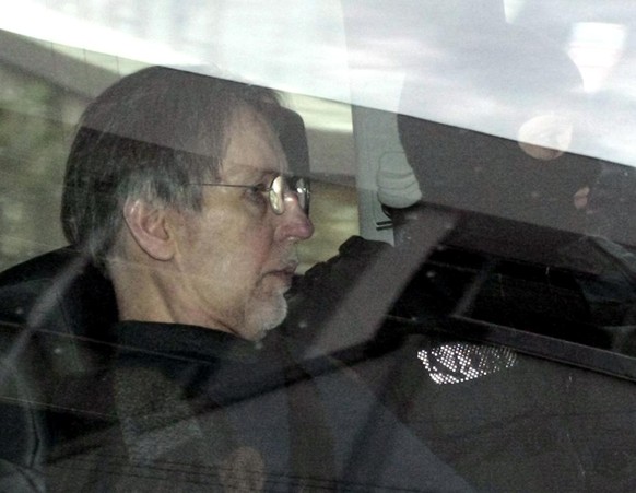 ** FILE ** Michel Fourniret, left, a French man accused of the serial murders of seven women and girls, is driven back under heavy police protection to the Charleville-Mezieres courthouse, northern Fr ...