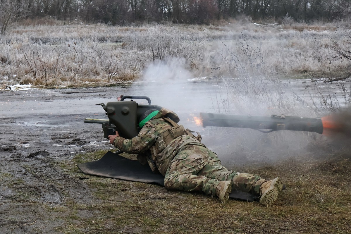 In this photo provided by Ukraine's 65th Mechanized Brigade press service, a soldier fires a MILAN, a Franco-German anti-tank missile system, during a drill close to the frontline on the site of  ...