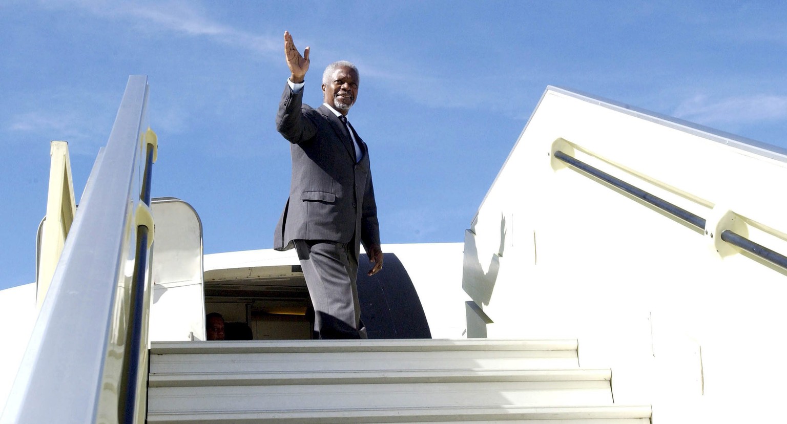 epa06955628 (FILE) - A handout photo made available by the United Nations Department of Public on 27 May 2005 shows UN Secretary General Kofi Annan waves at the door of a UN plane as he departs Addis  ...