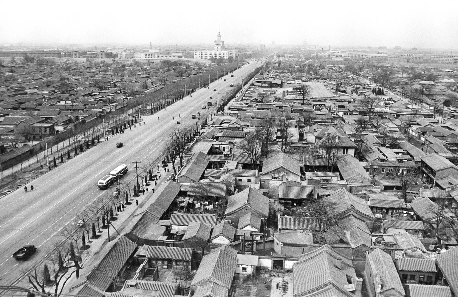 Main Street in Peking (Beijing) with older type housing estates on the right. Note absence of traffic, May 11, 1966. (AP Photo)