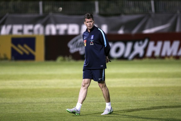 Greece&#039;s coach Michael Skibbe attends a training session a day ahead of their World Cup qualifying play-off second leg soccer match against Croatia, at Agios Kosmas training centre, near Athens,  ...