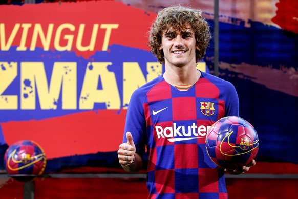 epa07717178 French striker Antoine Griezmann poses for the media during his presentation as a FC Barcelona's new player held at Camp Nou Stadium in Barcelona, Spain, 14 July 2019. EPA/Quique Garcia