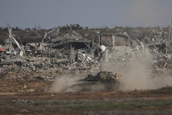 An Israeli tank manoeuvres in the Gaza Strip, as seen from southern Israel, Monday, May 19, 2025. (AP Photo/Ohad Zwigenberg)
Israel Palestinians
