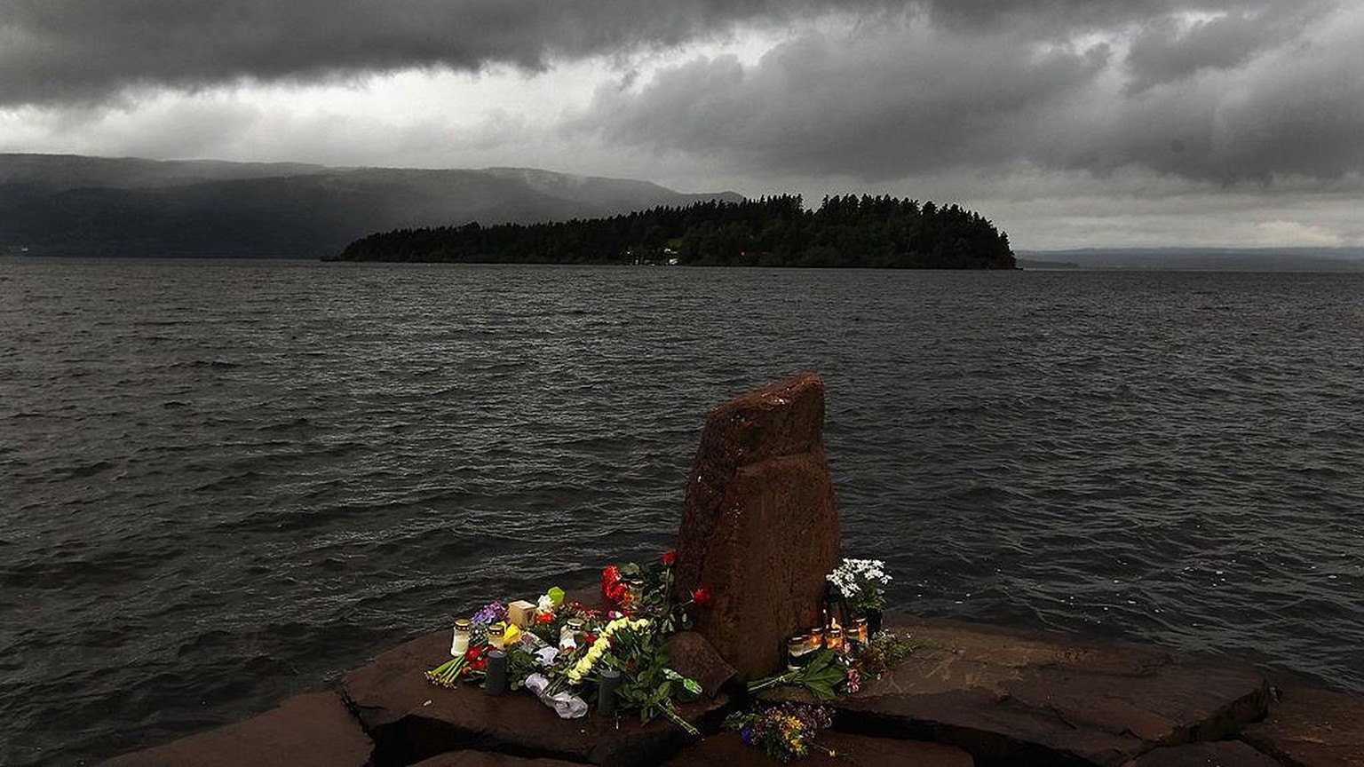 UTOYA ISLAND, NORWAY - JULY 24: Flowers rest near Utoya Island following Friday&#039;s twin extremist attacks, on July 24, 2011 in Norway. A man, named as Anders Behring Breivik, 32, has been arrested ...