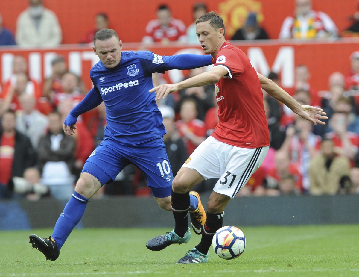 Everton's Wayne Rooney, left, and Manchester United's Nemanja Matic battle for the ball during the English Premier League soccer match between Manchester United and Everton at Old Trafford i ...
