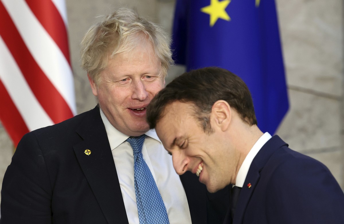 British Prime Minister Boris Johnson, left, speaks with French President Emmanuel Macron prior to a meeting of the Group of Seven at NATO headquarters in Brussels, Thursday, March 24, 2022. The Group  ...