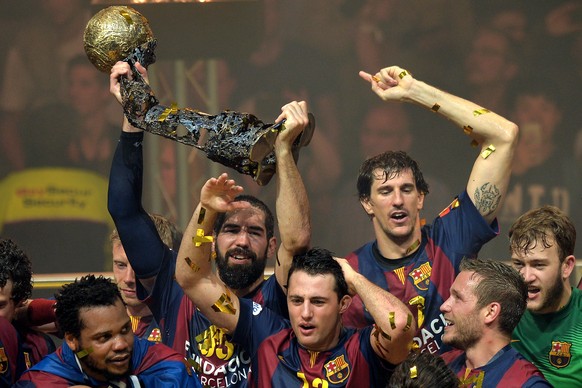 COLOGNE, GERMANY - MAY 31: Nikola Karabatic (L) of Barcelona celebrates with the trophy after winning the &quot;VELUX EHF FINAL4&quot; final match against MKB-MVM Veszprem at Lanxess Arena on May 31,  ...