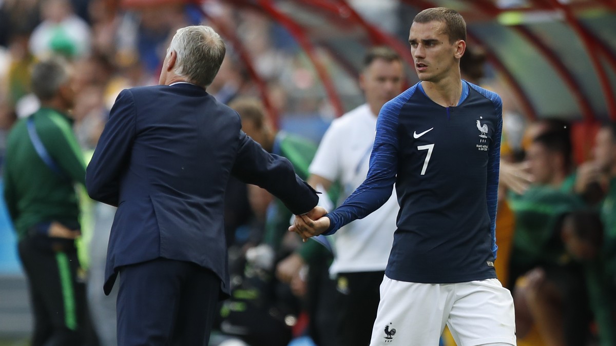 France's Antoine Griezmann, right shakes hands with France head coach Didier Deschamps after being substituted during the group C match between France and Australia at the 2018 soccer World Cup i ...