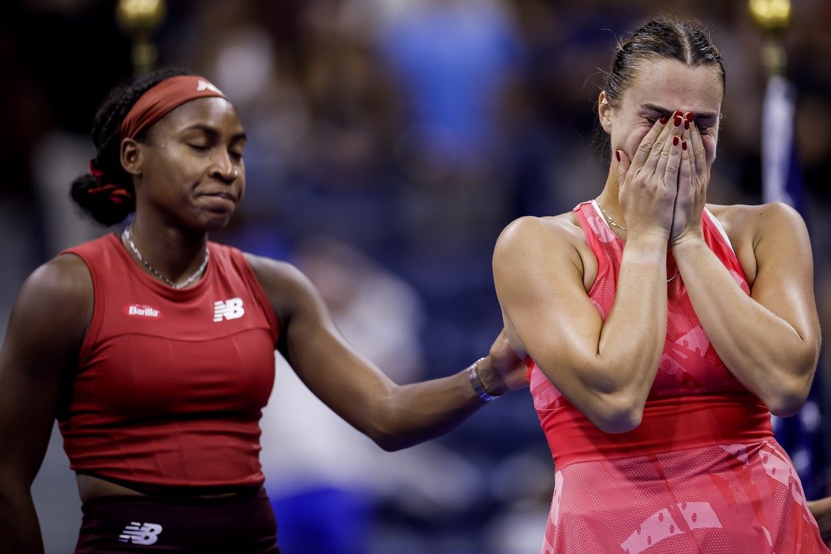 epa10851747 Coco Gauff (L) of the United States reacts with Aryna Sabalenka (R) of Belarus after Gauff defeated Sabalenka to win the women's singles final match during the US Open Tennis Champion ...