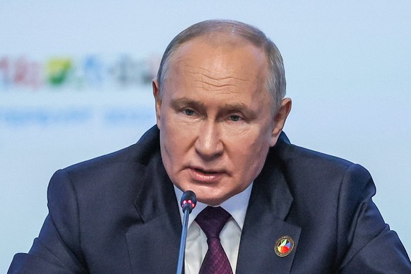 Russian President Vladimir Putin speaks during a plenary session at the Russia Africa Summit in St. Petersburg, Russia, Friday, July 28, 2023. (Donat Sorokin/TASS Host Photo Agency Pool Photo via AP)