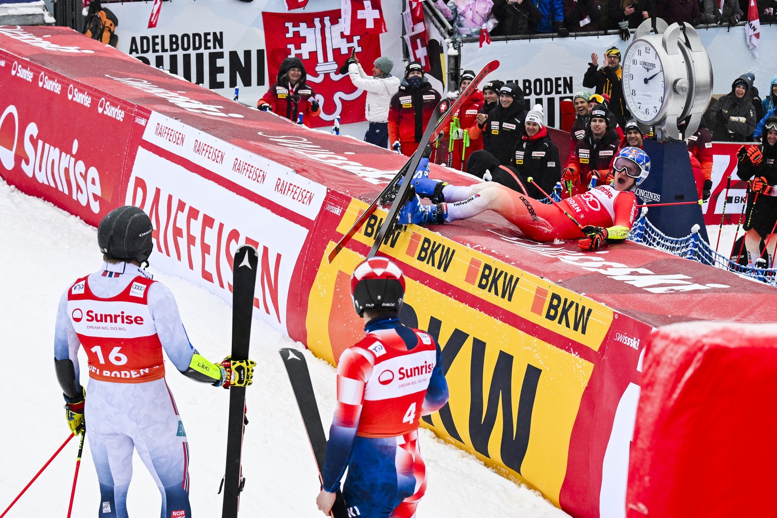 epa11060815 Second placed Aleksander Aamodt Kilde (L) of Norway and third placed Filip Zubcic (C) of Croatia, watch Marco Odermatt (R) of Switzerland celebrating after winning the Men&#039;s Giant Sla ...