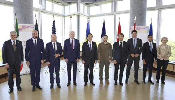 President Joe Biden, fourth from left, and Ukrainian President Volodymyr Zelenskyy, fifth from right, and other G7 leaders pose for a photo before a working session on Ukraine during the G7 Summit in ...