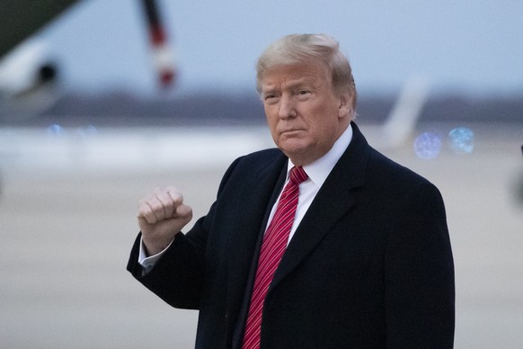 President Donald Trump pumps his fist as he steps off Air Force One as he arrives Sunday, Feb. 16, 2020, at Andrews Air Force Base, Md. (AP Photo/Alex Brandon)
Donald Trump,Trump