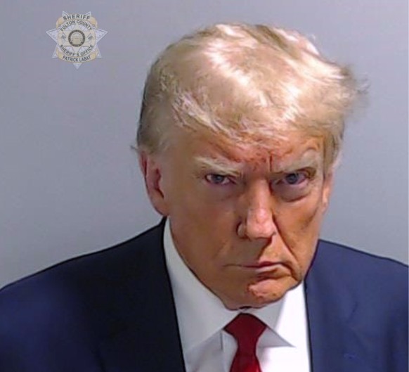 This booking photo provided by the Fulton County Sheriff?s Office shows former President Donald Trump on Thursday, Aug. 24, 2023, after he surrendered and was booked at the Fulton County Jail in Atlan ...