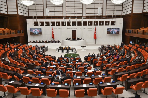 Turkish lawmakers vote in favor of Finland&#039;s bid to join NATO late Thursday, March 30, 2023, at the parliament in Ankara, Turkey. All 276 lawmakers present voted unanimously in favor of Finland&# ...