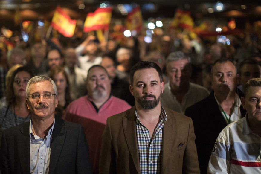 In this Wednesday, Nov. 14, 2018 photo, Spain&#039;s far-right Vox Party President Santiago Abascal, centre, takes part in a party rally in Murcia, Spain. Vox is reaching out to the neglected, working ...