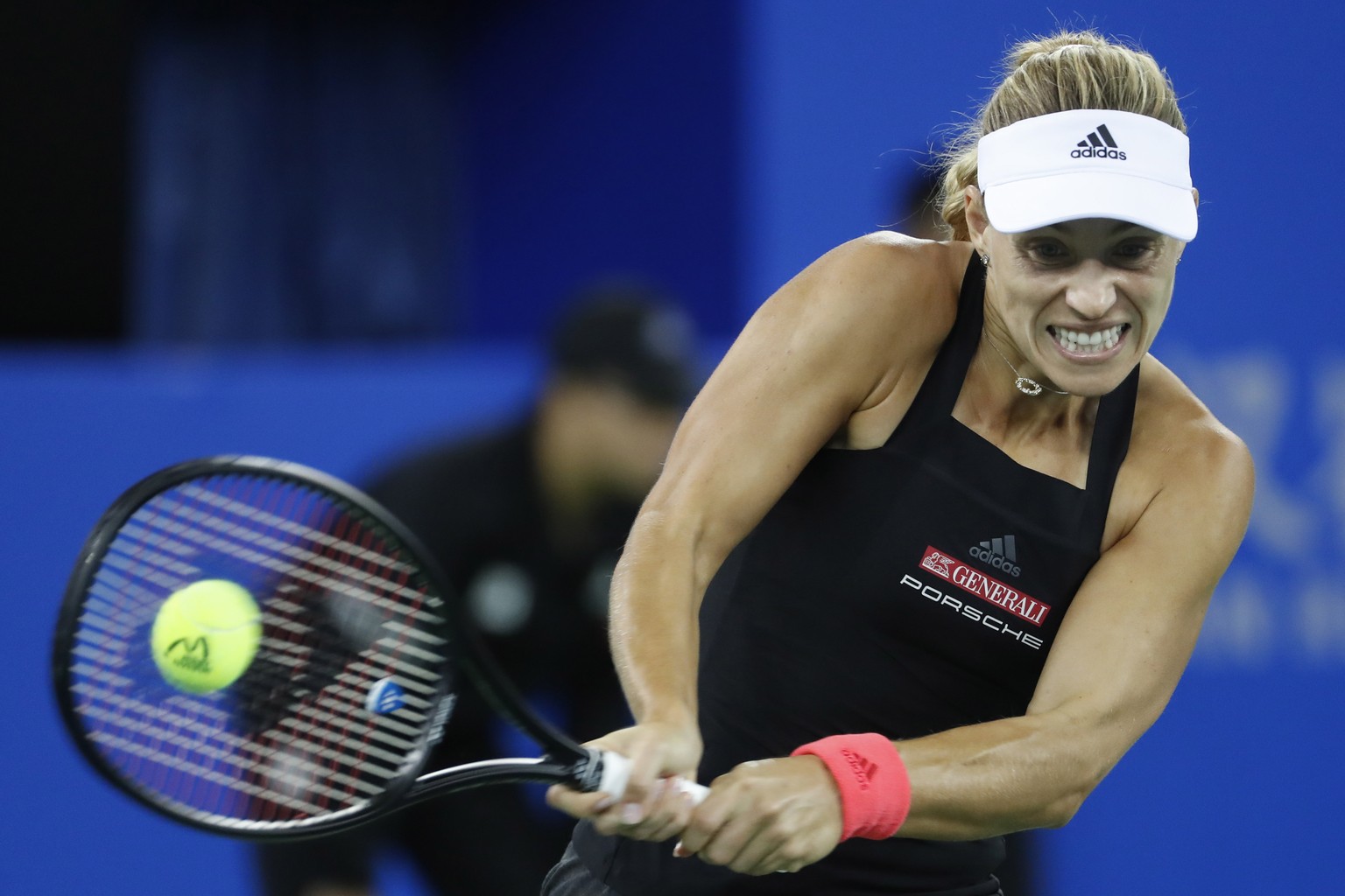 epa07047305 Angelique Kerber of Germany in action against Ashleigh Barty of Australia during their match at the 2018 WTA Wuhan Open tennis tournament in Wuhan city, Hubei province, China, 26 September ...