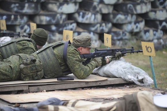 Recruits fire during a military training at a firing range in the Rostov-on-Don region in southern Russia, Tuesday, Oct. 4, 2022. Russian Defense Minister Sergei Shoigu said that the military has recr ...