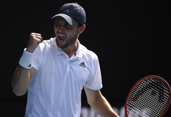 Russia&#039;s Aslan Karatsev reacts after winning a point against Bulgaria&#039;s Grigor Dimitrov during their quarterfinal match at the Australian Open tennis championship in Melbourne, Australia, Tu ...