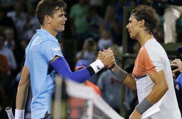 epa04143887 Rafael Nadal (R) of Spain shakes hands with Milos Raonic (L) of Canada after Nadal defeated Raonic in their quarter final match at the Sony Open tennis tournament on Key Biscayne in Miami, Florida, USA, 27 March 2014. Nadal won the match in three sets.  EPA/ERIK S. LESSER