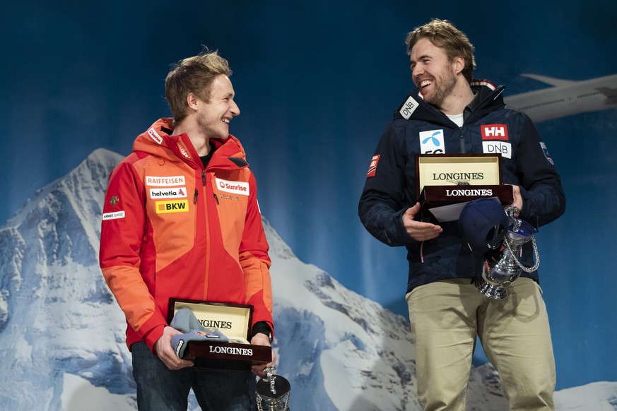 Winner Aleksander Aamodt Kilde of Norway, right, and second placed Marco Odermatt of Switzerland celebrate at the award ceremony of the men's downhill race at the Alpine Skiing FIS Ski World Cup in We ...