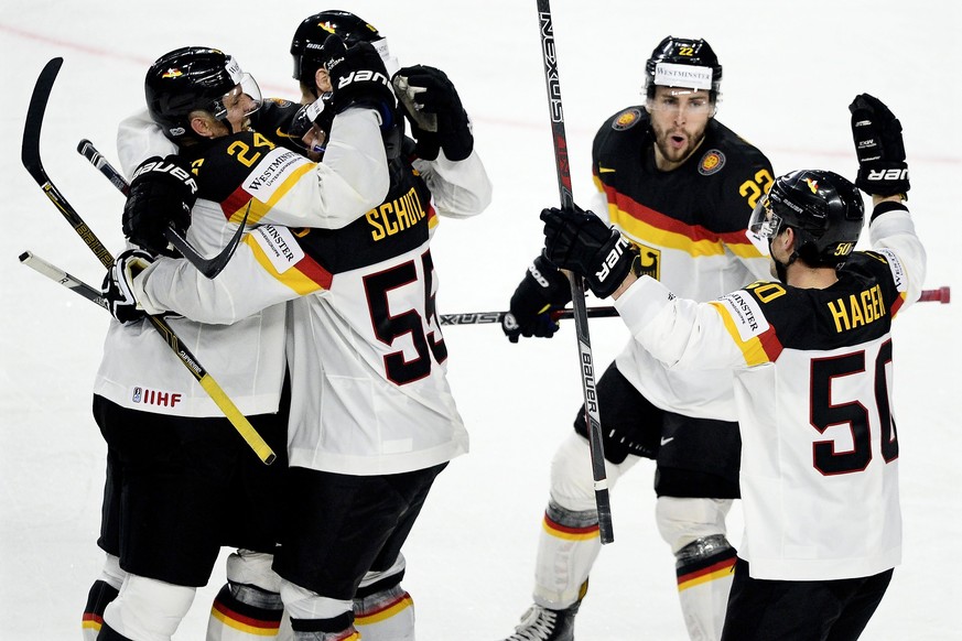 epa05946036 Germany&#039;s forward forward Patrick Hager (R) celebrates with his teammates after scoring the 2-1 lead during the 2017 IIHF Ice Hockey World Championship group A preliminary round match ...