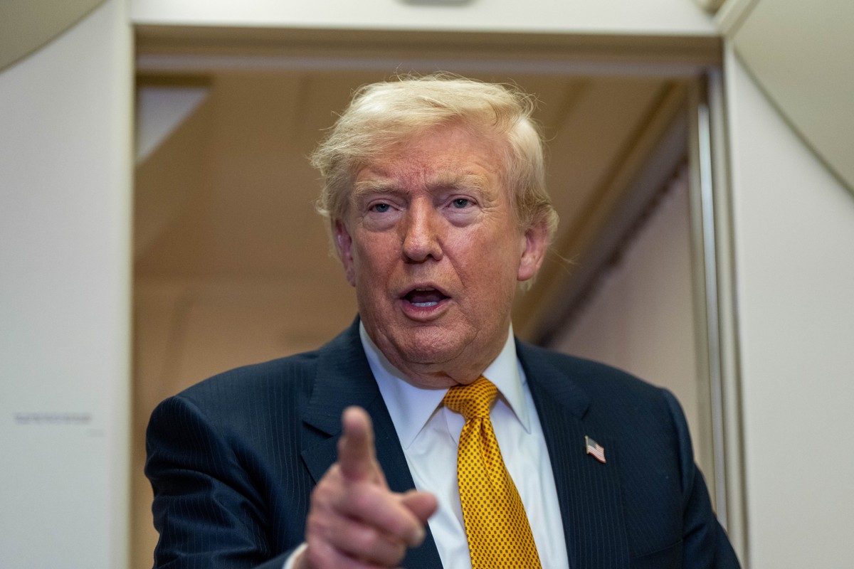 President Donald Trump speaks with reporters in flight on Air Force One after landing at U.S. Air Force Base at RAF Mildenhall, in Suffolk Eastern England, Wednesday, July 8, 2026. (AP Photo/Alex Bran ...