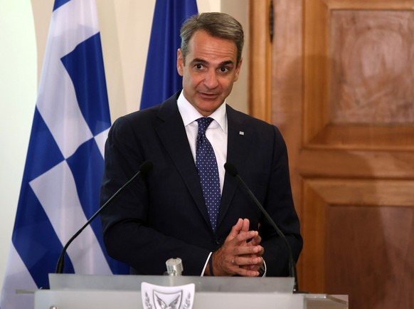 epa10778353 Greek Prime Minister Kyriakos Mitsotakis attends a joint news conference with Cyprus&#039; president at the Presidential Palace in Nicosia, Cyprus, 31 July 2023. EPA/YIANNIS KOURTOGLOU / P ...
