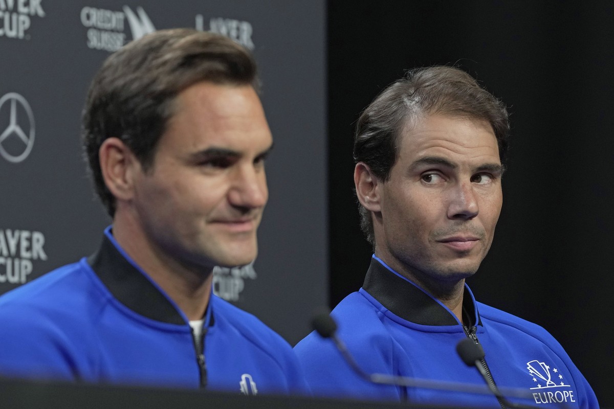 Switzerland's Roger Federer, left, and Spain's Rafael Nadal attend a press conference ahead of the Laver Cup tennis tournament at the O2 in London, Thursday, Sept. 22, 2022. (AP Photo/Kin Ch ...