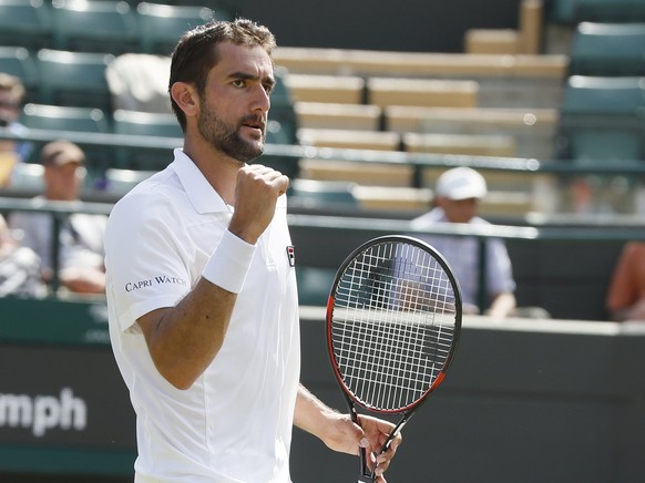 Croatia&#039;s Marin Cilic celebrates after winning the Men&#039;s Singles Match against Steve Johnson of the United States on day five at the Wimbledon Tennis Championships in London Friday, July 7,  ...