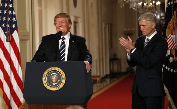 U.S. President Donald Trump announces his nomination of Neil Gorsuch to be an associate justice of the U.S. Supreme Court as Gorsuch (R) applauds at the White House in Washington, D.C., U.S., January  ...