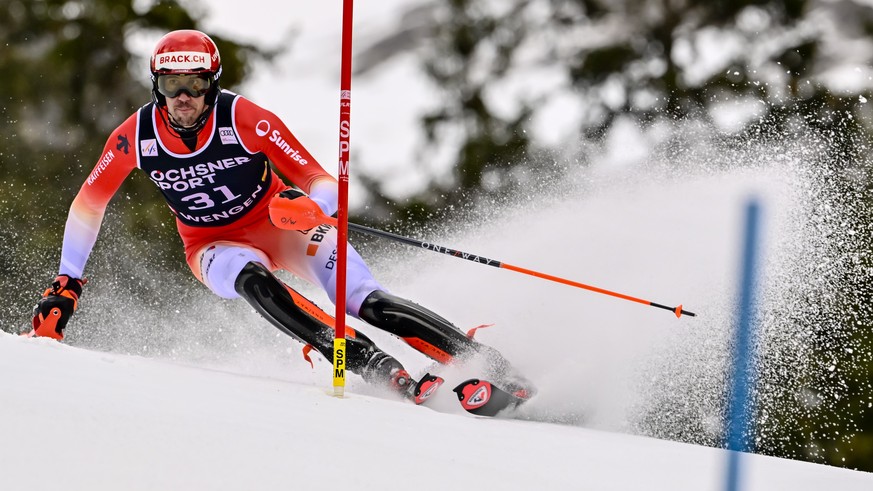 epa11835722 Ramon Zenhaeusern of Switzerland in action during the first run of the men&#039;s Slalom race at the FIS Alpine Skiing World Cup in Wengen, Switzerland, 19 January 2025. EPA/JEAN-CHRISTOPH ...