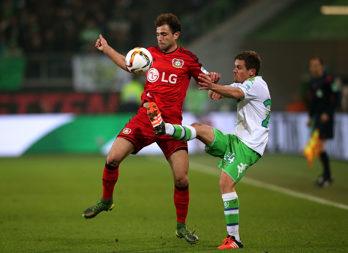 WOLFSBURG, GERMANY - OCTOBER 31: Sebastian Jung (R) of Wolfsburg vies with Admir Mehmedi (L) of Leverkusen during the Bundesliga match between VfL Wolfsburg and Bayer Leverkusen at Volkswagen Arena on ...