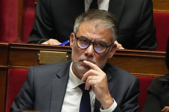 Secretary general of the French Socialist Party listens to French Prime Minister Sebastien Lecornu&#039;s policy speech at the National Assembly, Tuesday, Oct. 14, 2025 in Paris. (AP Photo/Thibault Ca ...