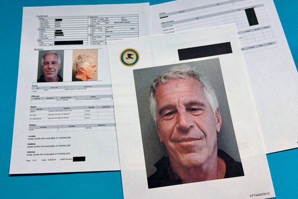 Documents that were included in the U.S. Department of Justice release of the Jeffrey Epstein files are photographed Friday, Jan. 2, 2026. (AP Photo/Jon Elswick)
Justice Department Jeffrey Epstein