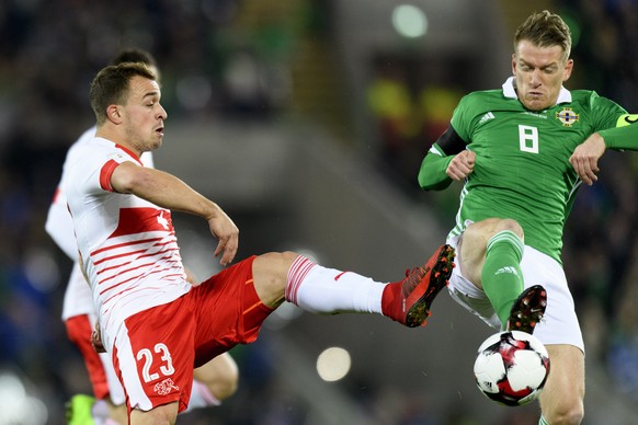 Switzerland&#039;s midfielder Xherdan Shaqiri, left, fights for the ball with Northern Ireland&#039;s midfielder Steven Davis, right, during the 2018 Fifa World Cup play-offs first leg soccer match No ...