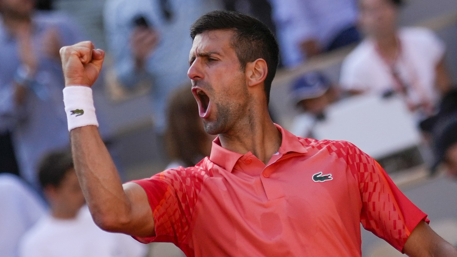 Serbia&#039;s Novak Djokovic celebrates winning his quarterfinal match of the French Open tennis tournament against Russia&#039;s Karen Khachanov in four sets, 4-6, 7-6 (7-0), 6-2, 6-4, at the Roland  ...