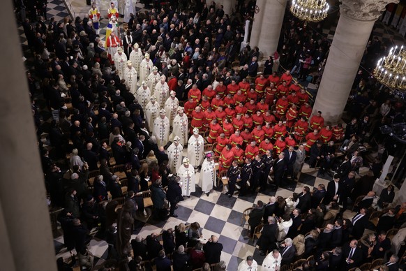 epaselect epa11763185 Clerics arrive to attend the reopening ceremony of the Notre Dame de Paris Cathedral in Paris, France 07 December 2024. Paris? Cathedral took almost 6 years to rebuild after been ...